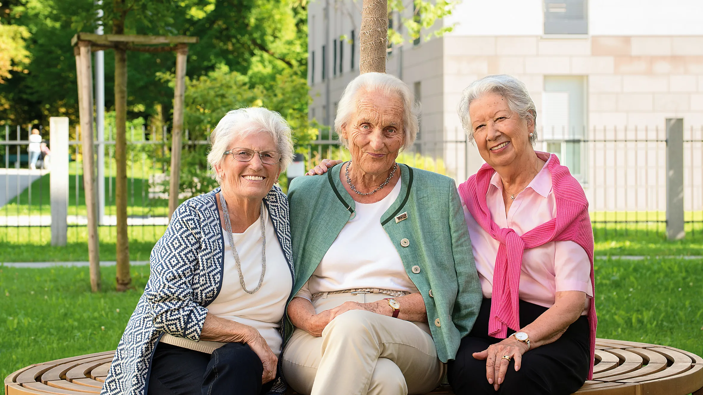 Three friends enjoy the lovely weather in the residence garden